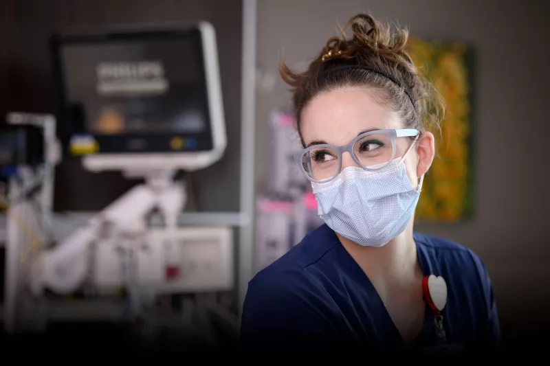 A nurse focusing her attention on someone