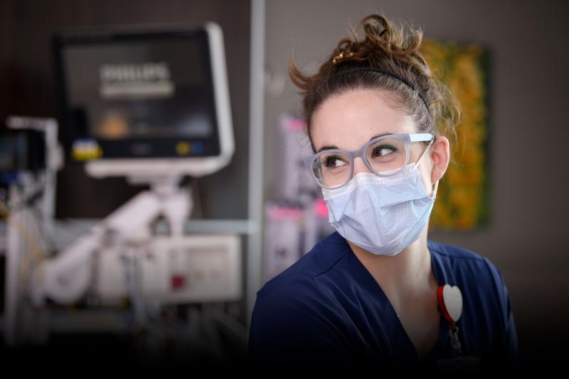 A nurse focusing her attention on someone